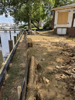 Waterfront shoreline grading and bulkhead backfill on a Maryland tidal property