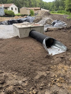 New driveway culvert and stone headwall at the end of a private lane in Dorchester County, Maryland