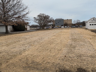 Graded and seeded commercial lot after site work in Maryland